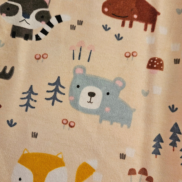 Wildlife on beige background. Flannel and terry cloth