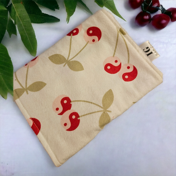 Cherries with off-white background. Snuggly flannel and terry cloth.